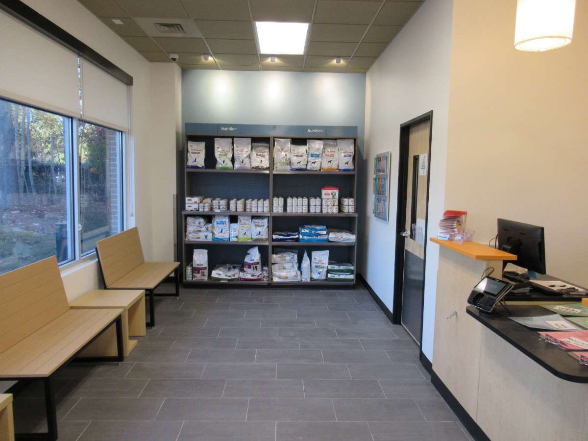Supply shelves and the front desk at the Banfield Garner hospital