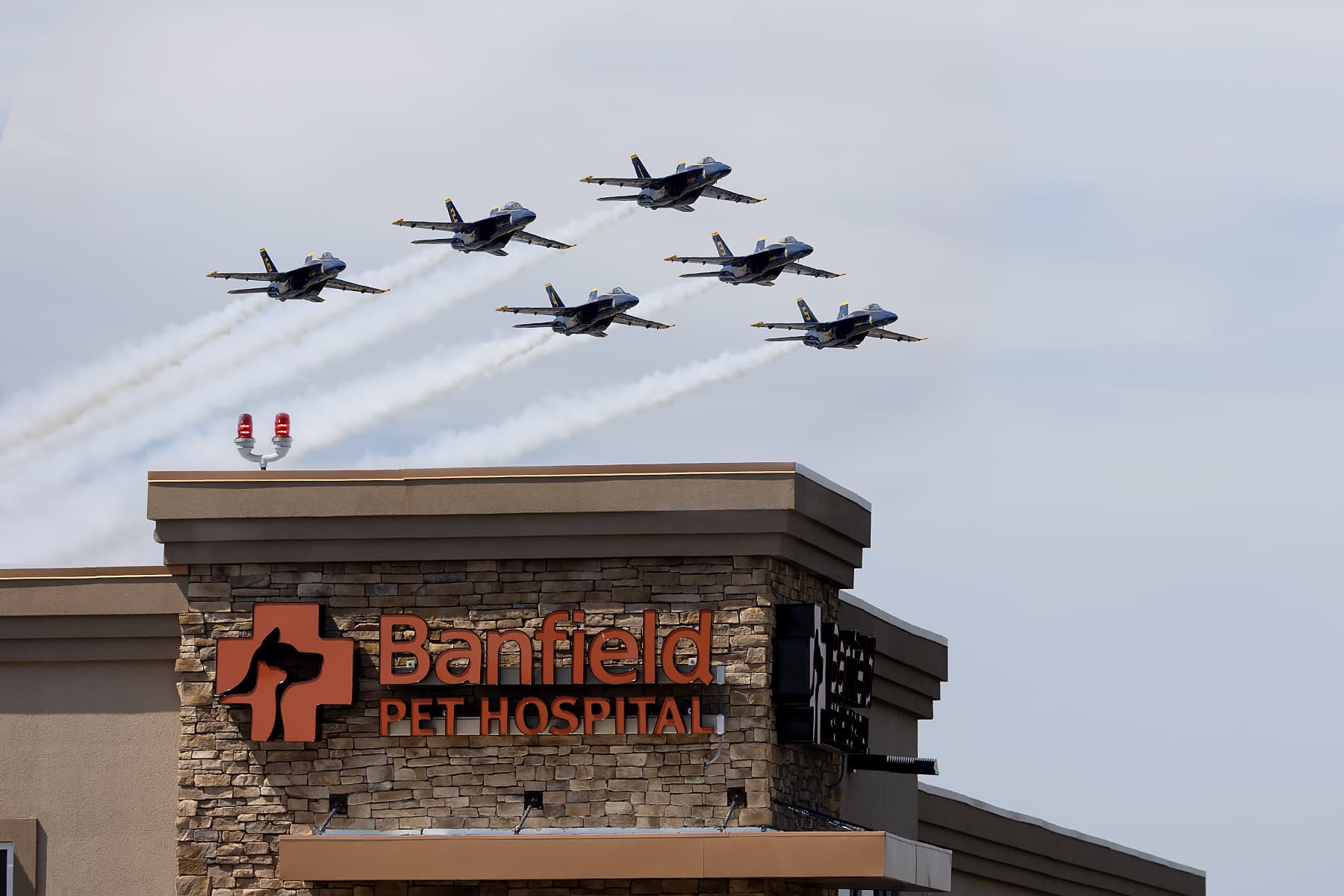 7 fighter jets flying over Banfield Farmingdale Seven Daughters