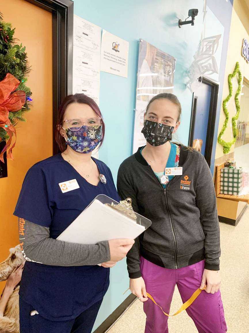 A couple of young female associates at the Banfield Pet Hospital